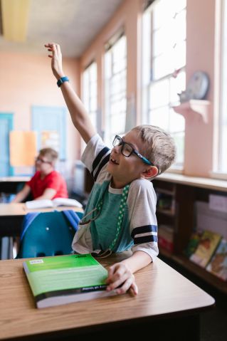 Boy in Green Shirt Wearing Eyeglasses