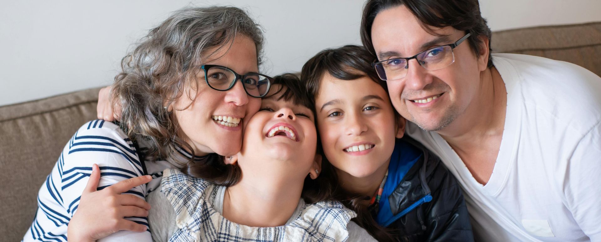 Family Sitting Together on a Sofa