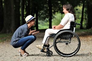 Woman on Black Folding Wheelchair